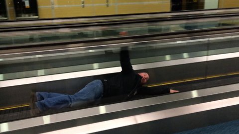 Guy has a funny way to kill time at the airport