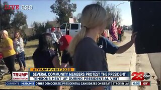 Several community members protest the President