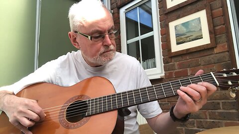 Playing a classical guitar with a reesha or oud pick 6