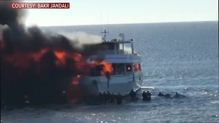 Video shows casino boat engulfed in flames while passengers jump into the chilly Gulf waters to escape