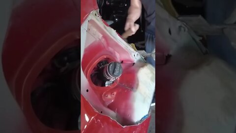 Pulling out a destroyed Bmw m3 wheel arch