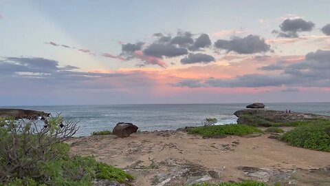 Ocean gales, rocks, rainbow clouds, and sunset, at Laie Point State Wayside Park.