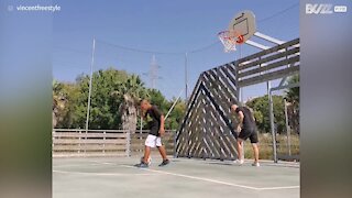 Youngster shoots hoop backwards using feet!