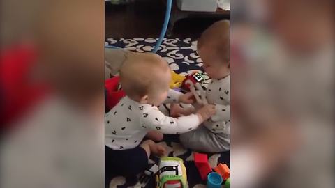 "Twin Baby Girls Fight Over A Toy"