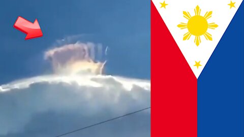 Rainbow-coloured crown over cloudy Mindoro Island in the Philippines [Mysterious]