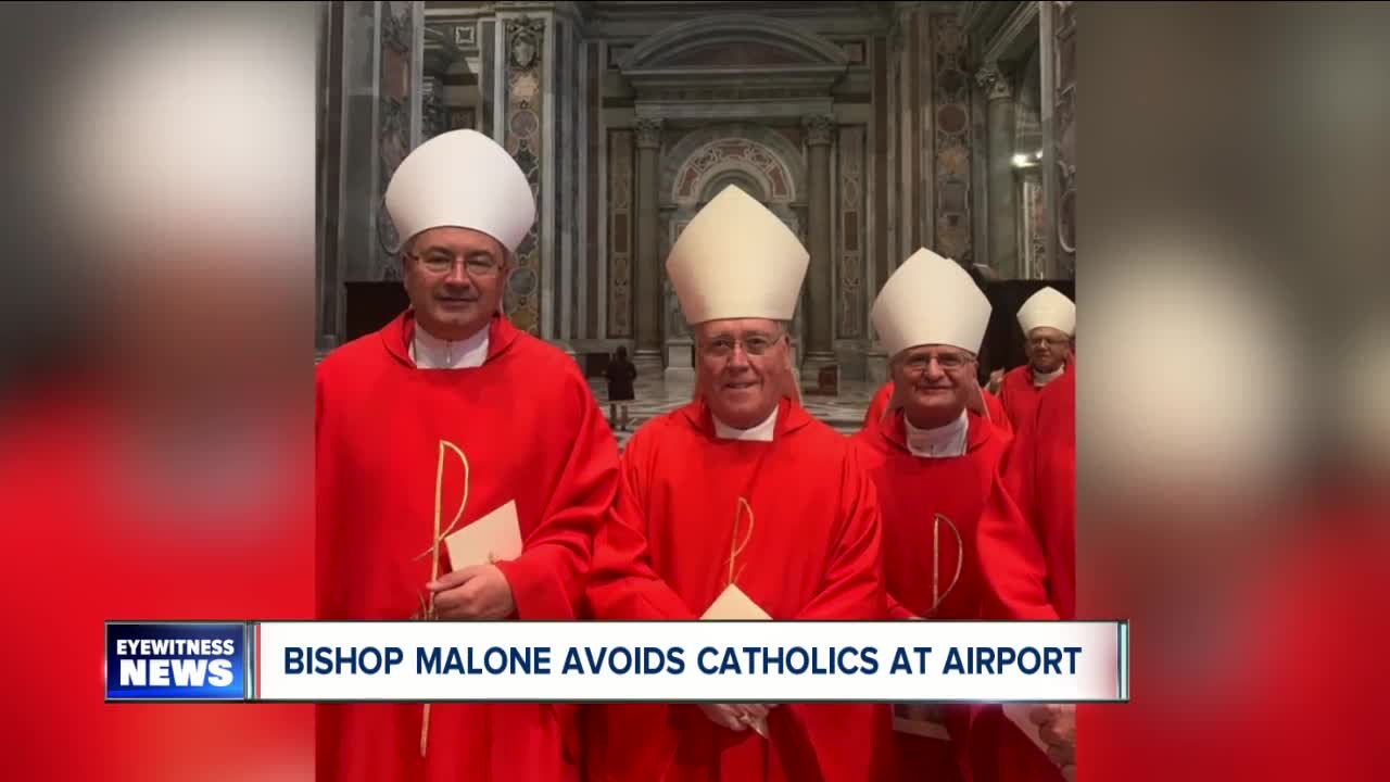 Returning from Rome, Bishop Malone avoids reporters and Catholics at airport