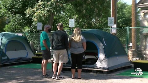 Neighbors react to mock homeless camp on display in North Cap Hill
