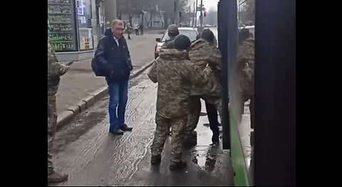 Agents Drag A Ukraininan Man Off A Bus To Conscript Him Into The Military