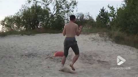 Triple front flip on beach