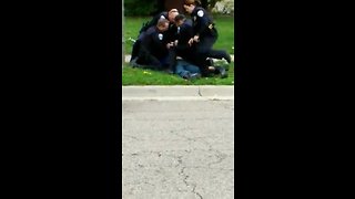 RAW: Akron police caught on camera tasing, punching man on ground during arrest