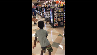 Little Boy Has Impromptu Dance-Off With Another Boy At Grocery Checkout