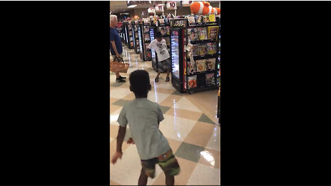 Little Boy Has Impromptu Dance-Off With Another Boy At Grocery Checkout