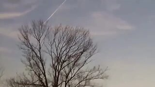 Woman spraying vinegar at the sky to kill chemtrails