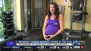Pregnant trainer inspires others at the gym