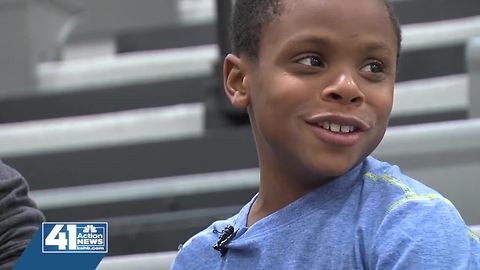 Olathe West basketball team embraces young fan with intellectual disability