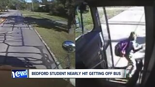 Caught on camera: A driver jumps the curb and drives onto a lawn while kids got off school bus