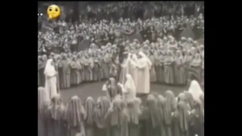 Queen Elizabeth participating in a pagan druidic ritual around the time of her coronation.