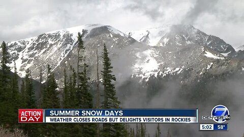 Snow closes roads but delights visitors in Rockies