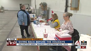 Salvation Army volunteers making Christmas meal kits