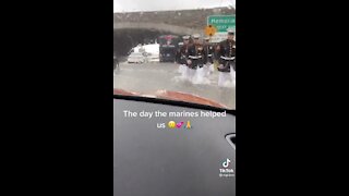 Marines Walk Thru Floodwaters to Help Stranded Driver