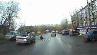 Dash cam captures car colliding with pedestrian