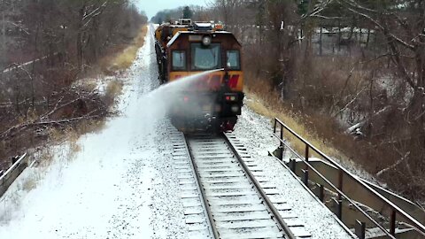 Train almost takes out drone with water canon