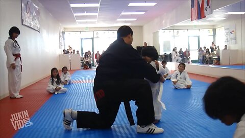 Little boy is trying to break a board as part of the Taekwondo| funny activity