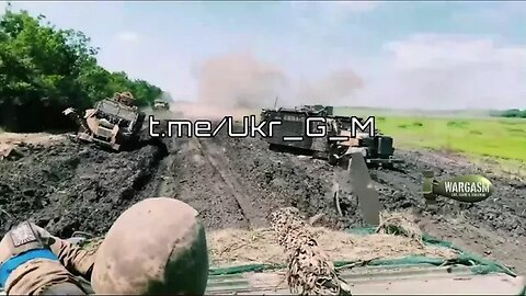 Three destroyed Ukrainian MRAPs in a field & explosion