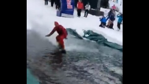 Snowboarder surfing ends up in classic epic fail
