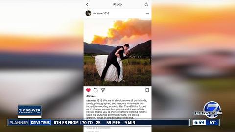 Couple takes wedding photo with 416 Fire in background following last-minute venue change
