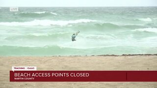 Wind surfers on Stuart Beach as impacts from Isaias are felt