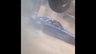 Nissan GTR drifting in garage.