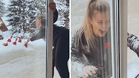 Woman falls into deep snow trying to reach for chilled wine