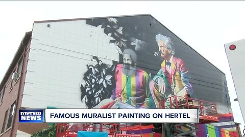 Famous painter painting mural on Hertel Ave.