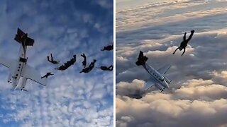 Skydivers' plane goes into free fall and spins past them after it stalls