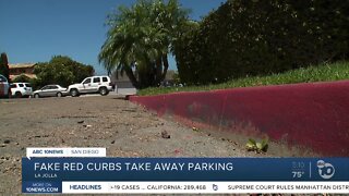 Fake red curbs take away public parking near beaches