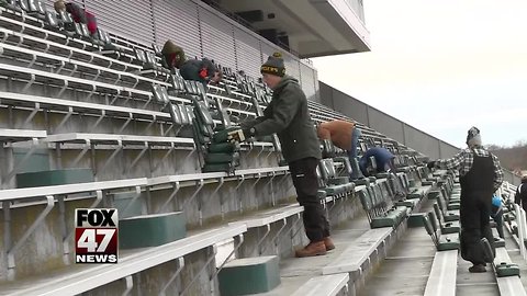 Boy Scouts pulling seats for money