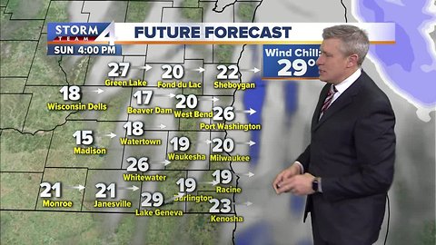 Wintry mix moves out, winds linger