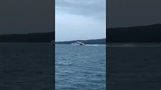 Ferries passing past Rangitoto Island.