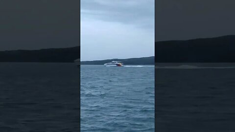 Ferries passing past Rangitoto Island.