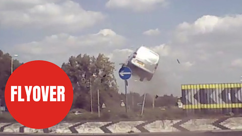 Shocking moment speeding van is filmed flying over roundabout