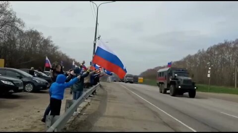 People greeting a Russian military column heading to the front in the Voronezh Oblast