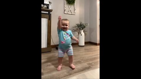baby is very happy and he is dancing