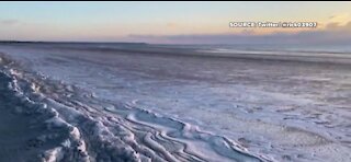 Video shows a frozen beach in Maine