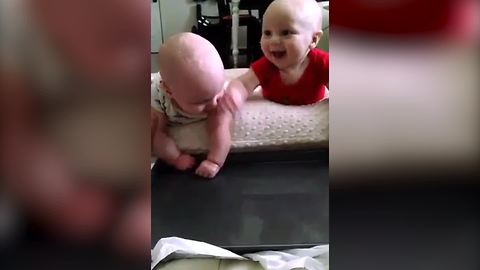 Twin Baby Boys Laugh As They Splash Water In A House