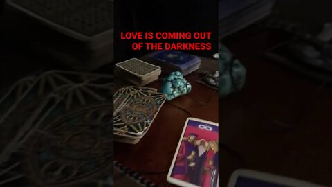 Tarot Card on the floor SPIRIT NEEDS YOU TO KNOW LOVE IS COMING OUT OF THE DARKNESS