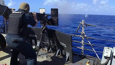 USS John S. McCain conducts live-fire exercise