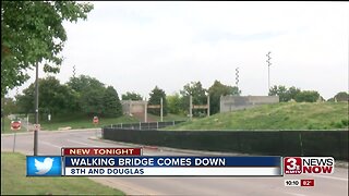 Walking bridge comes down