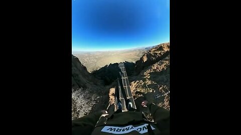 Man Jumps off cliff with his parachute failing. (Leg is clearly broken)