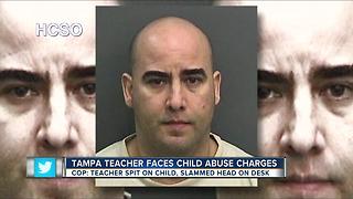 Teacher arrested for shoving, spitting on student during class